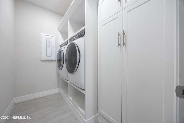 clothes washing area featuring washing machine and clothes dryer