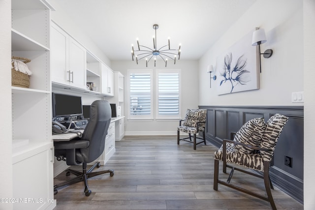 office area featuring dark wood-type flooring and a notable chandelier