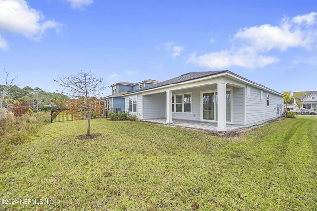 94 Hickory Pine Dr, Saint Augustine, FL 32092 - back of house featuring a patio area