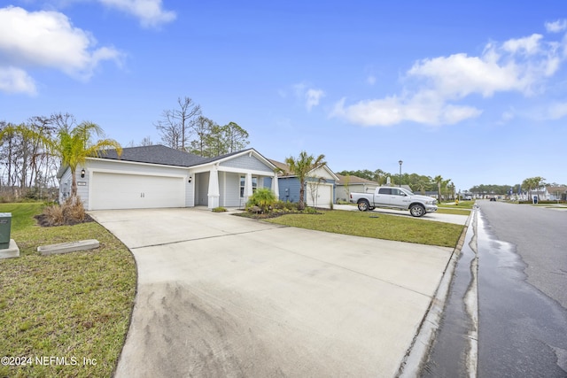 ranch-style house with a front yard and a garage