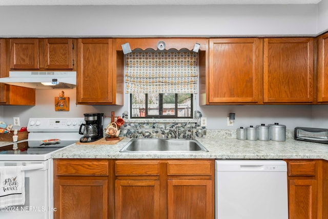 kitchen with white appliances and sink