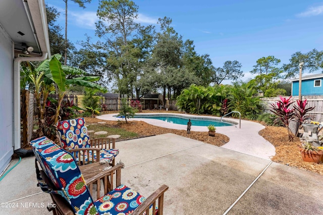 view of swimming pool with a patio