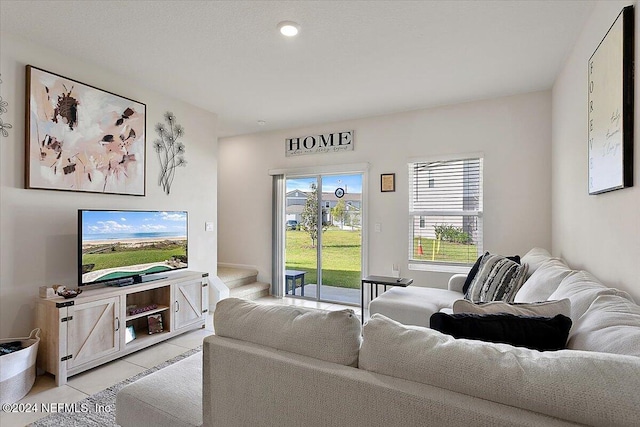 living room with light tile patterned flooring