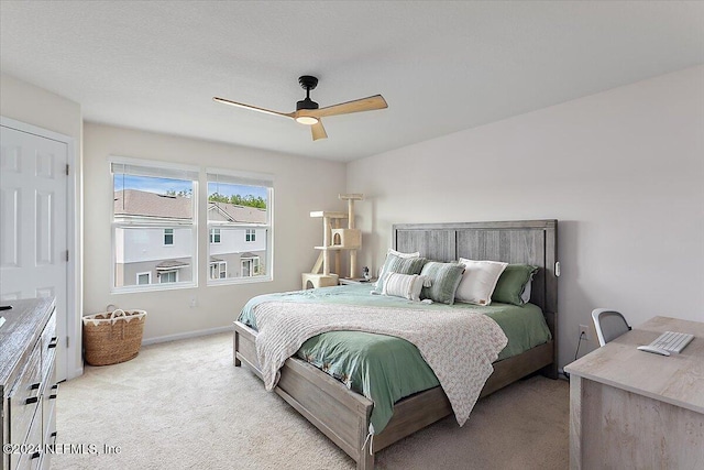 bedroom with light carpet and ceiling fan