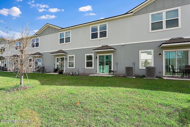 108 Coastline Way, Saint Augustine, FL 32092 - rear view of property with board and batten siding and a yard