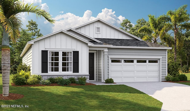 view of front of home with a front lawn and a garage