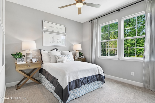 bedroom with ceiling fan and carpet floors