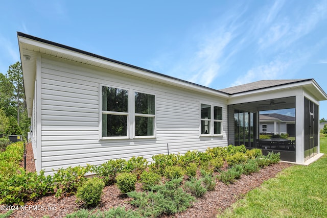 view of home's exterior featuring a sunroom