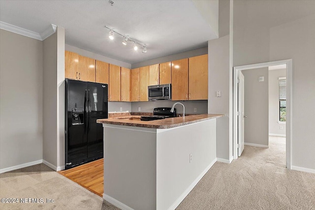 kitchen with light brown cabinets, black appliances, crown molding, light colored carpet, and kitchen peninsula