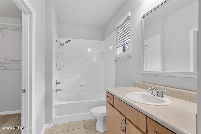 full bathroom with tile patterned flooring, vanity, toilet, and tiled shower / bath combo