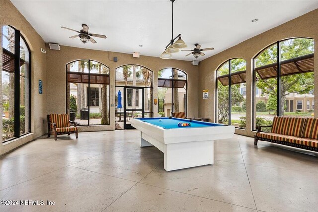 recreation room with ceiling fan, plenty of natural light, and billiards