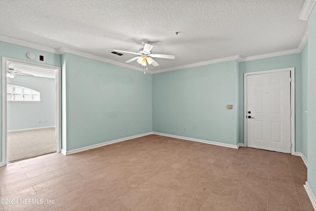 empty room featuring a textured ceiling, ceiling fan, and crown molding