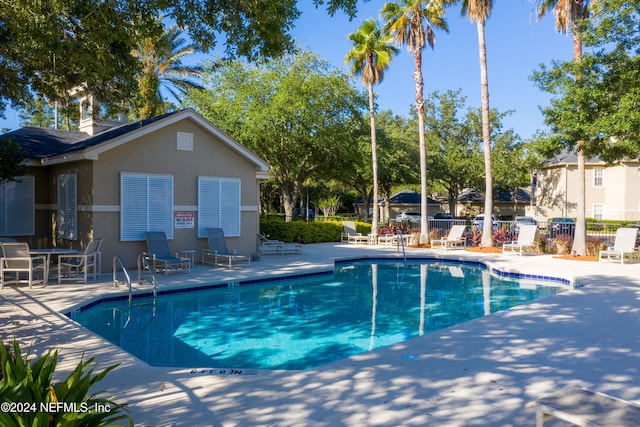 view of swimming pool with a patio