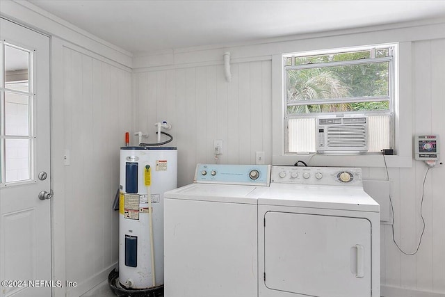 laundry room with washer and clothes dryer, cooling unit, wooden walls, and water heater