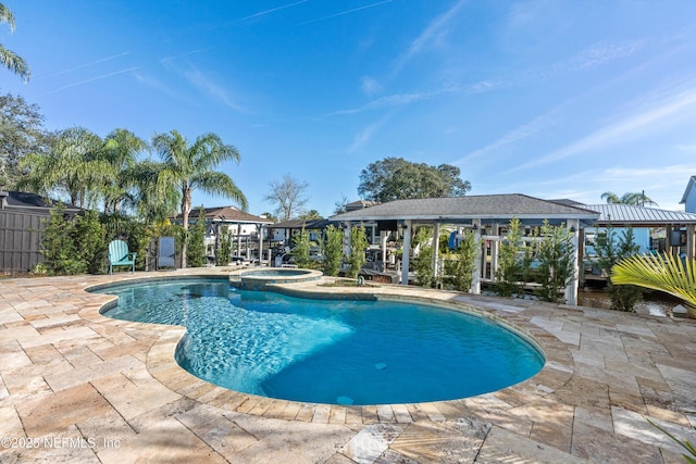 view of swimming pool with an in ground hot tub and a patio