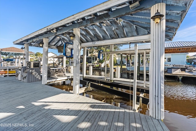 dock area featuring a water view