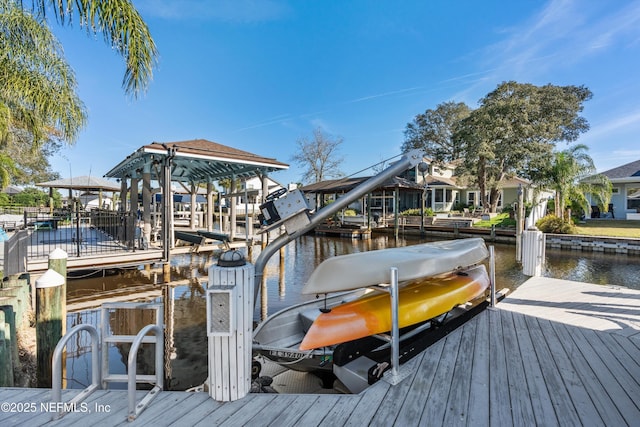 dock area with a water view