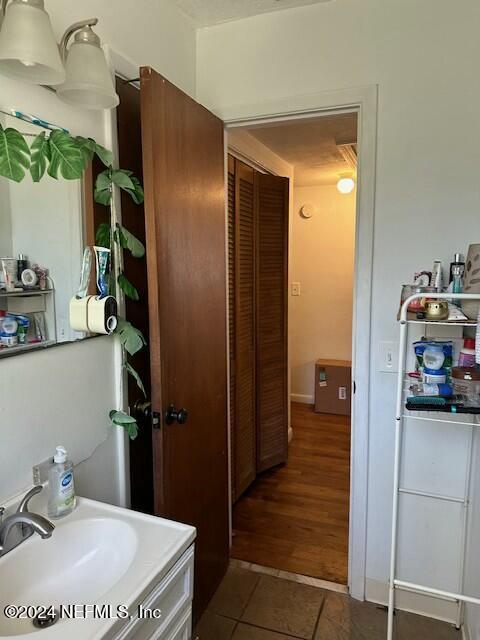 bathroom with vanity and tile patterned floors