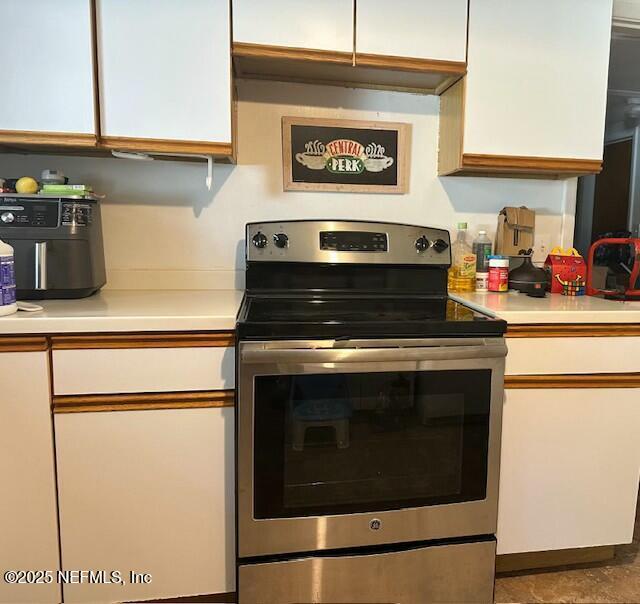 kitchen with white cabinetry and stainless steel electric range oven