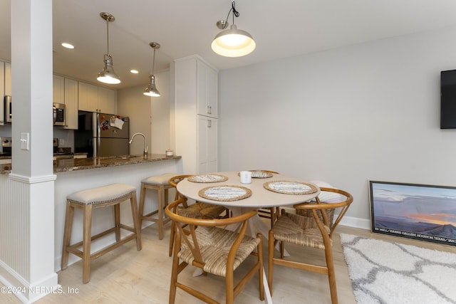 410 1st St S Unit C, Jacksonville Beach, FL 32250 - dining space with light wood-style floors, baseboards, and recessed lighting