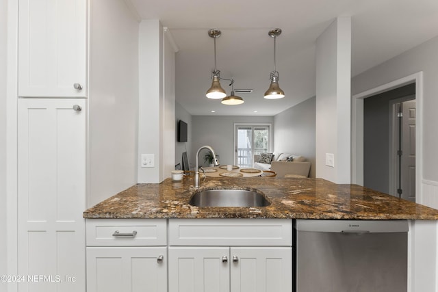 410 1st St S Unit C, Jacksonville Beach, FL 32250 - kitchen featuring a sink, dishwasher, and white cabinets