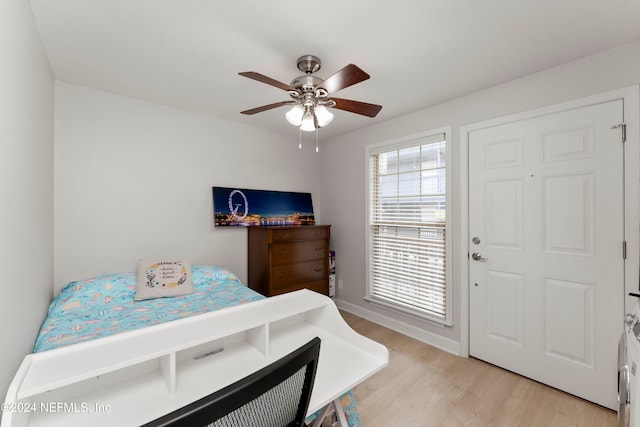 bedroom featuring light wood-type flooring and ceiling fan