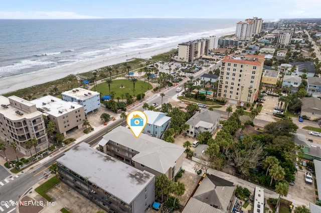 drone / aerial view with a water view and a view of the beach