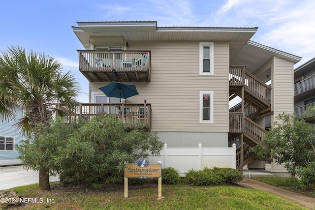 410 1st St S Unit C, Jacksonville Beach, FL 32250 - back of property featuring a balcony and stairway
