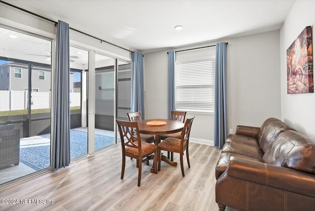 dining space featuring light wood-type flooring