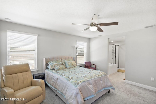 bedroom with ceiling fan, light colored carpet, and multiple windows