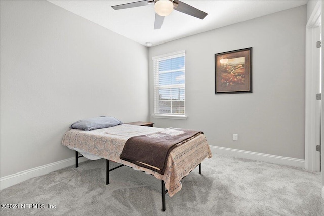 bedroom featuring ceiling fan and light colored carpet