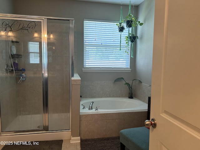 full bath featuring a shower stall, tile patterned floors, and a garden tub