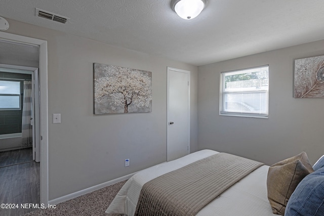 bedroom featuring a textured ceiling