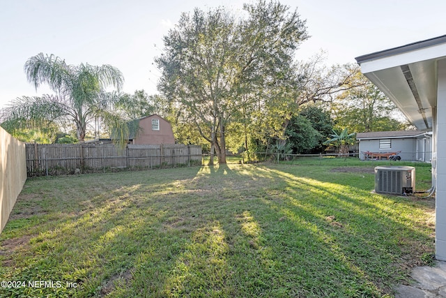 view of yard with central AC