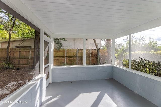 unfurnished sunroom featuring a wealth of natural light