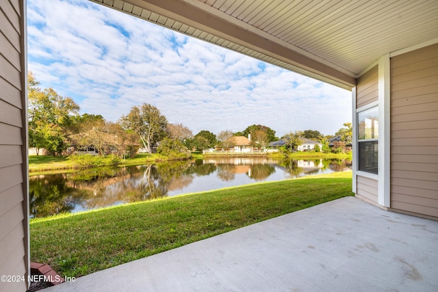 view of patio with a water view