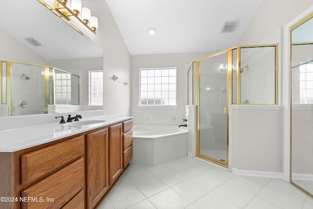 bathroom with tile patterned floors, vanity, independent shower and bath, and vaulted ceiling