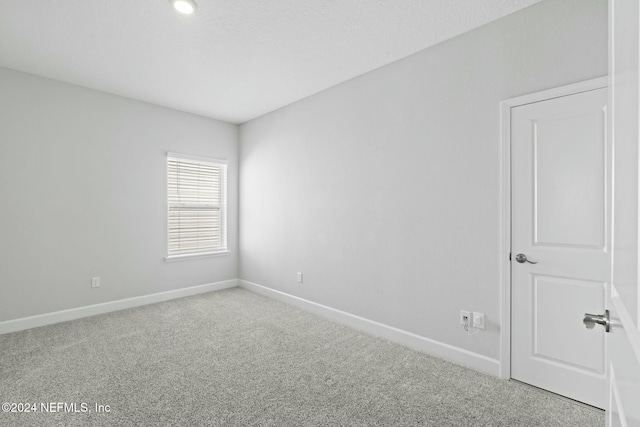 spare room with carpet flooring