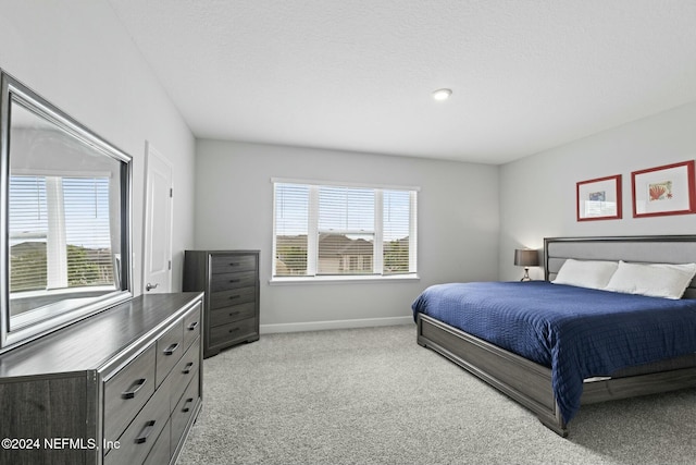 bedroom featuring light colored carpet