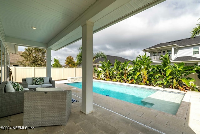 view of pool with a patio and an outdoor hangout area