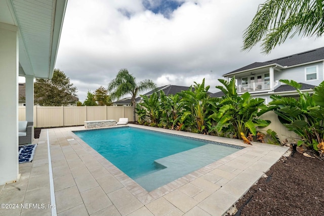 view of pool featuring a patio area