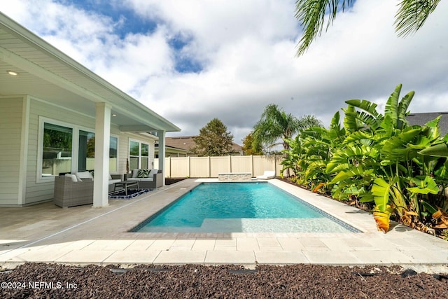 view of swimming pool featuring an outdoor living space and a patio