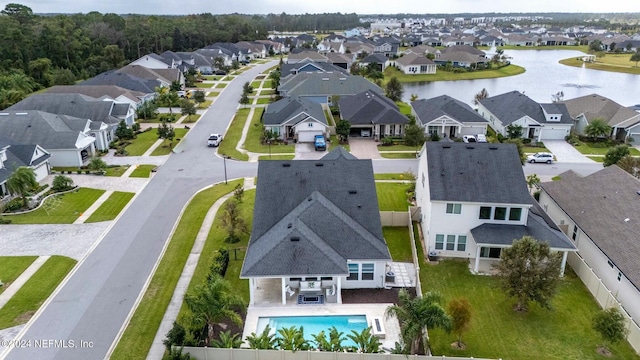 birds eye view of property with a water view