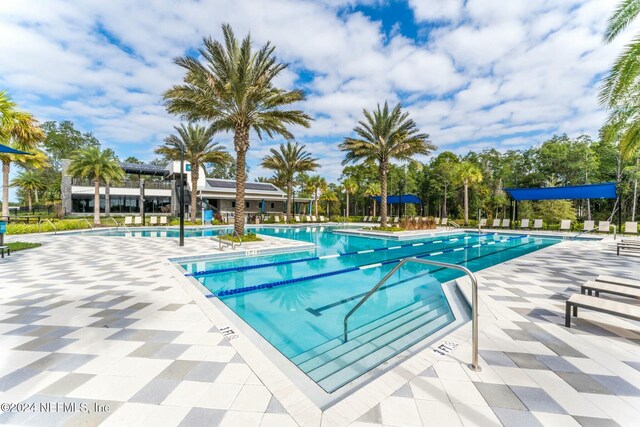 view of swimming pool with a patio area