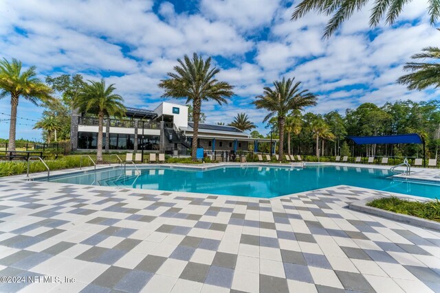 view of swimming pool with a patio area