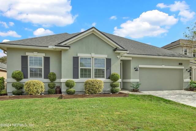 single story home with a front yard and a garage