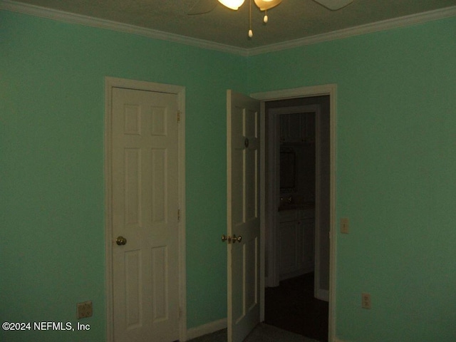 unfurnished bedroom featuring ceiling fan and ornamental molding