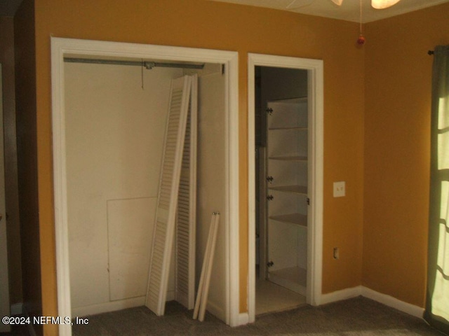 unfurnished bedroom featuring a closet and carpet floors