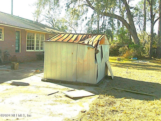 view of outdoor structure featuring a yard