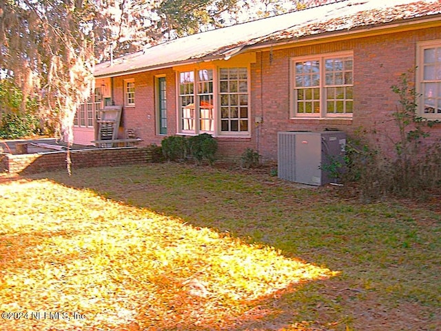 rear view of house with central AC